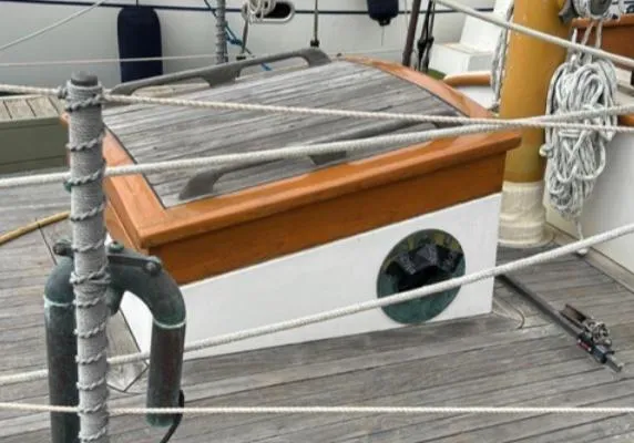 Slide: The Image of Winch on 1982 Bristol Channel Cutter 28 sailboat, docked with visible ropes and deck. - 24