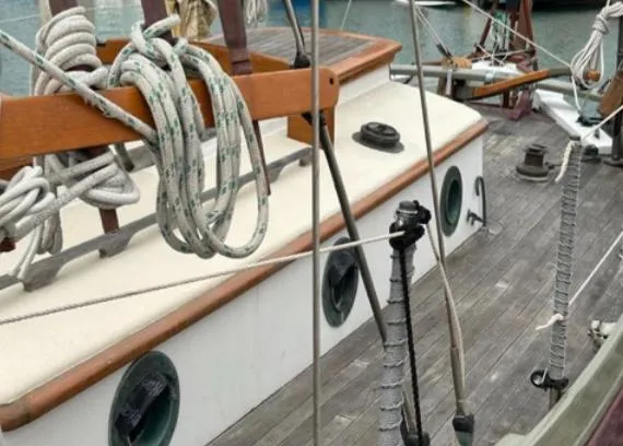Slide: The Image of 1982 Bristol Channel Cutter 28 sailboat docked, showcasing deck and rigging details. - 25