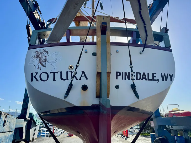 Slide: The Image of Interior of 1982 Bristol Channel Cutter 28, featuring cozy seating and wooden cabinetry. - 5