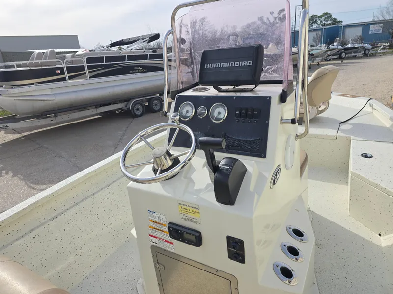Slide: The Image of 2019 Xpress H20B boat console with steering wheel and Humminbird electronics. - 9