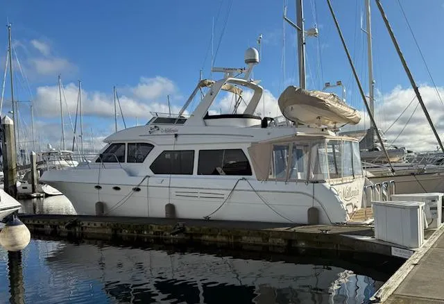 The Image of 2007 Navigator 51 yacht docked at marina under clear blue sky. - 0