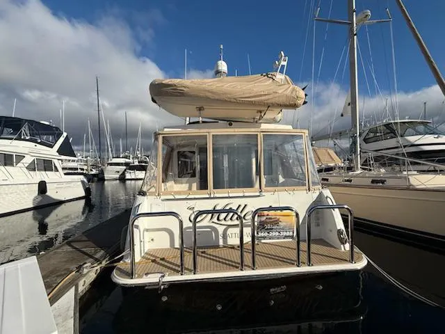 Slide: The Image of Luxurious 2007 Navigator 51 yacht bathroom with wood paneling and modern shower. - 14