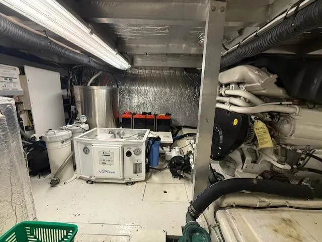 Slide: The Image of Engine room of a 2007 Navigator 51 yacht, featuring machinery and equipment. - 20