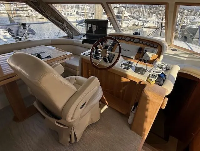 Slide: The Image of Luxurious 2007 Navigator 51 yacht interior with modern kitchen and wooden cabinetry. - 5