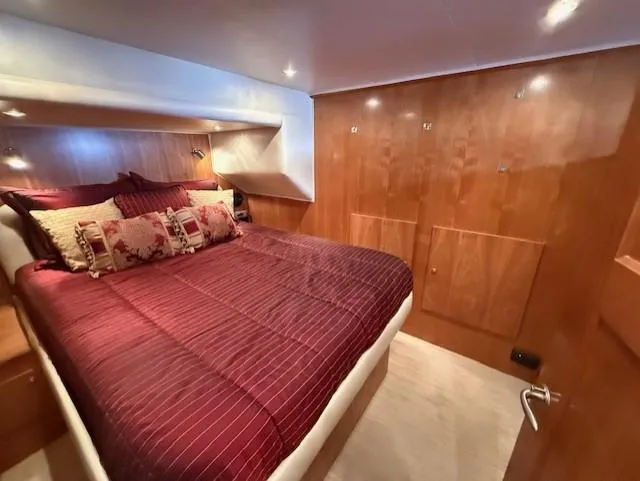 Slide: The Image of 2007 Navigator 51 yacht kitchen with hidden storage compartment and modern appliances. - 6