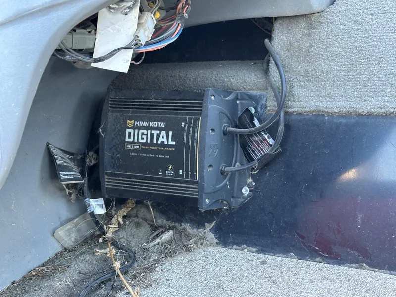 Slide: The Image of Minn Kota digital charger in 2011 Tracker Super Guide V16 boat interior. - 11