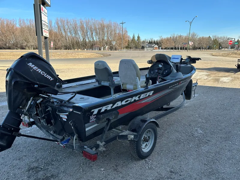 Slide: The Image of 2011 Tracker Super Guide V16 boat with Mercury engine on trailer. - 5