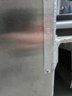 Slide: The Image of Close-up of a metal surface with engraved serial number, G3 322rc, 2025 model. - 10