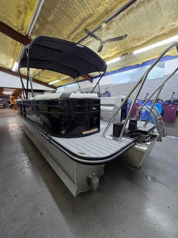 Slide: The Image of 2025 G3 322rc pontoon boat in showroom, featuring sleek design and spacious seating. - 3