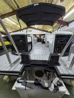 Slide: The Image of 2025 G3 322rc boat interior with canopy, showcasing spacious deck and seating. - 4