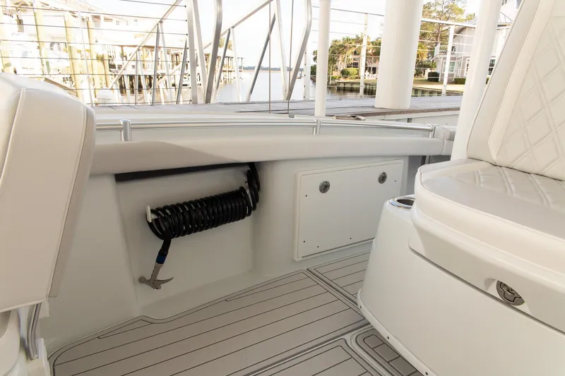 Slide: The Image of 2023 Yellowfin 26 Hybrid boat interior with seating and storage compartments. - 11