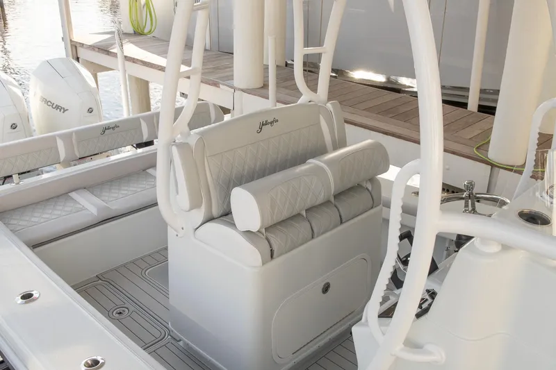 Slide: The Image of 2023 Yellowfin 26 Hybrid boat interior with cushioned seating and modern design. - 14