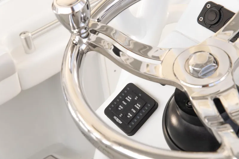 Slide: The Image of Steering wheel of 2023 Yellowfin 26 Hybrid boat, featuring modern controls. - 15