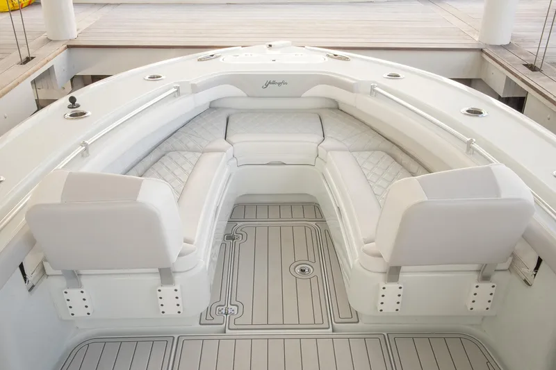 Slide: The Image of 2023 Yellowfin 26 Hybrid boat interior with cushioned seating and sleek design. - 25