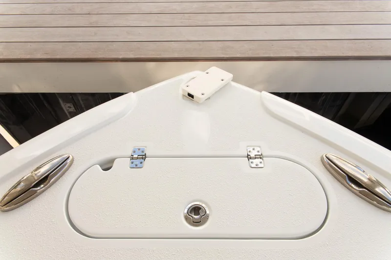 Slide: The Image of 2023 Yellowfin 26 Hybrid boat deck with storage compartment and cleats. - 27