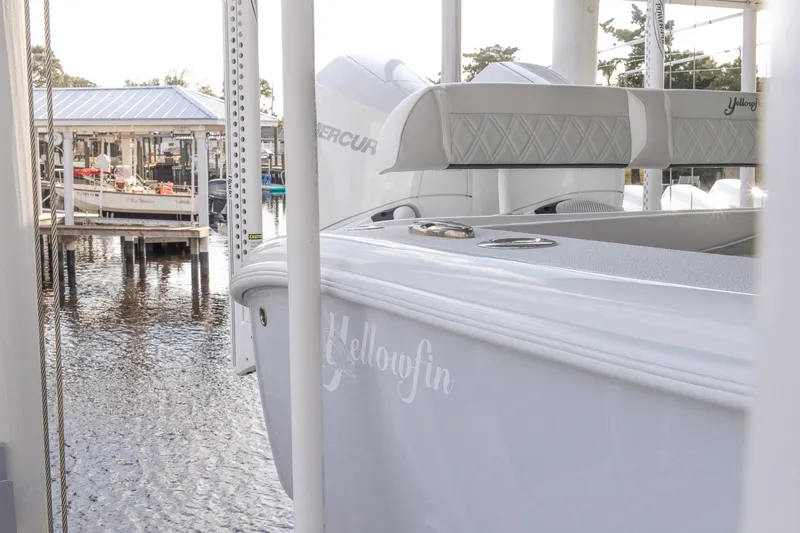 Slide: The Image of 2023 Yellowfin 26 Hybrid boat docked, showcasing sleek design and powerful engines. - 3