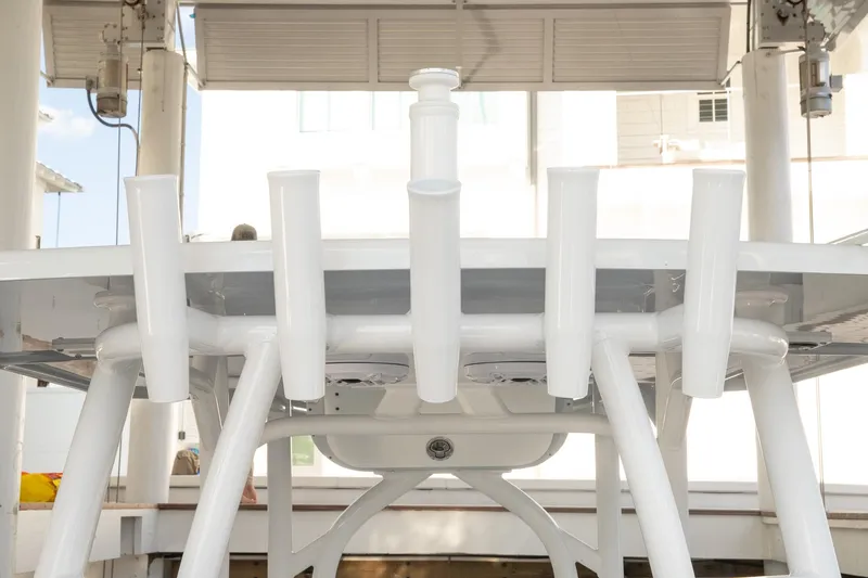 Slide: The Image of 2023 Yellowfin 26 Hybrid boat rod holders under a canopy. - 32
