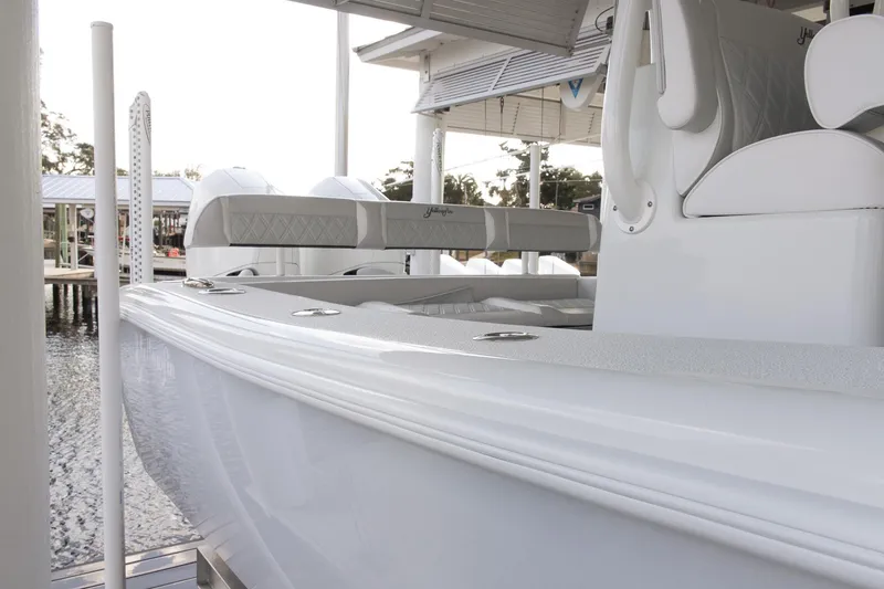 Slide: The Image of 2023 Yellowfin 26 Hybrid boat docked, showcasing sleek design and modern features. - 4