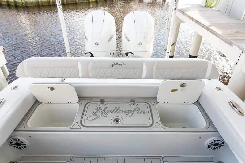 Slide: The Image of 2023 Yellowfin 26 Hybrid boat interior with dual engines and storage compartments. - 8