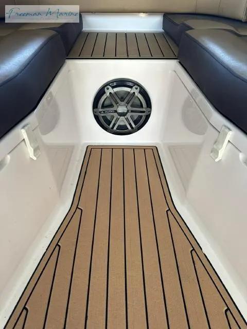 Slide: The Image of 2018 Fountain 38 CC boat interior with cushioned seating and marine speaker. - 17