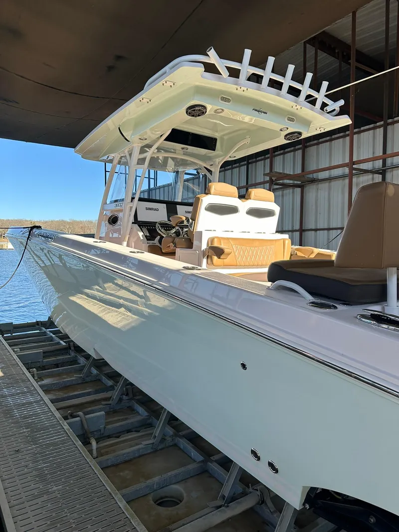 Slide: The Image of 2018 Fountain 38 CC boat in dock, featuring sleek design and modern amenities. - 5