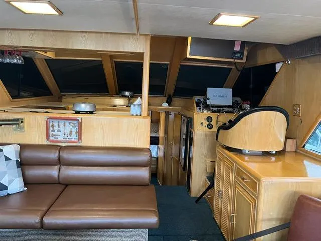 Slide: The Image of Interior of 1989 Ocean Alexander 42 yacht with leather seating and navigation equipment. - 12