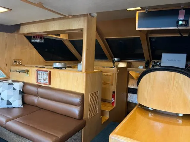 Slide: The Image of Interior of 1989 Ocean Alexander 42 yacht with leather seating and navigation equipment. - 13