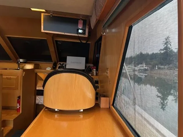 Slide: The Image of Interior of 1989 Ocean Alexander 42 yacht with navigation equipment and scenic window view. - 16