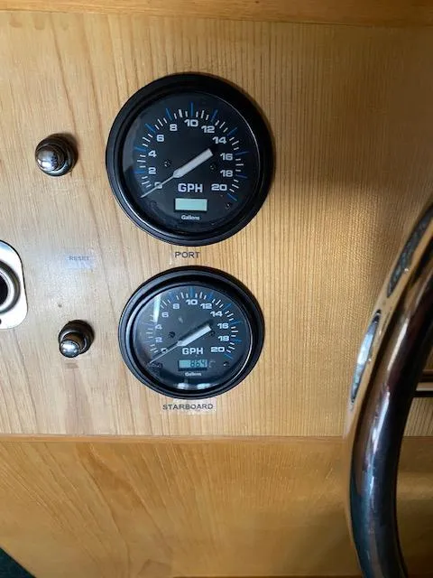 Slide: The Image of Dashboard gauges on a 1989 Ocean Alexander 42 boat, showing fuel consumption in GPH. - 24