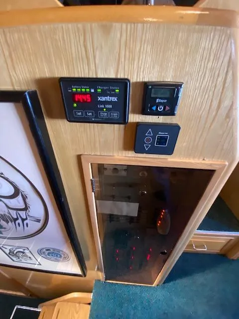 Slide: The Image of Control panel inside a 1989 Ocean Alexander 42 yacht, featuring Xantrex Link 1000 display. - 26