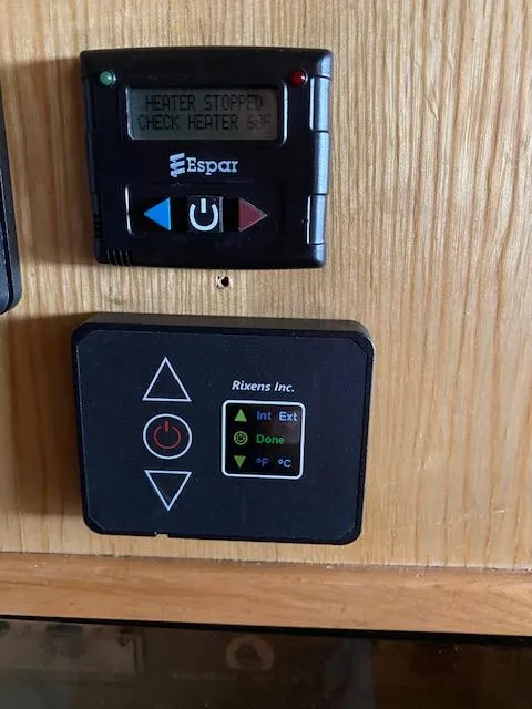 Slide: The Image of Control panels on a 1989 Ocean Alexander 42 yacht, featuring Espar heater display. - 27