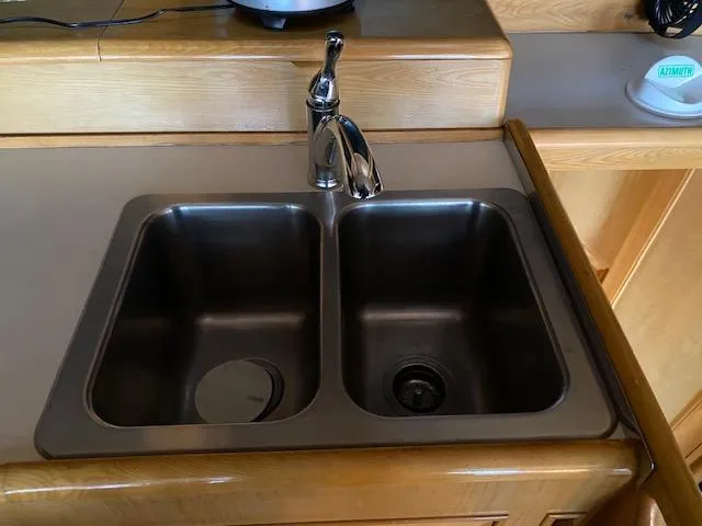 Slide: The Image of Stainless steel double sink in 1989 Ocean Alexander 42 yacht kitchen. - 32