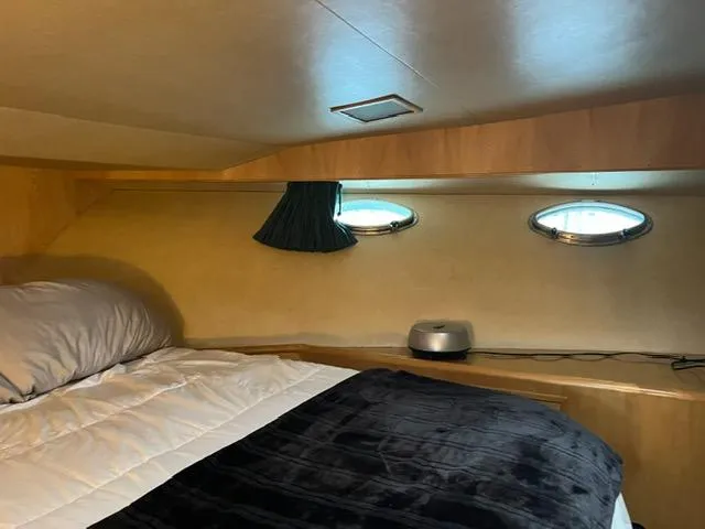 Slide: The Image of Cozy cabin interior of 1989 Ocean Alexander 42 yacht with porthole windows. - 37