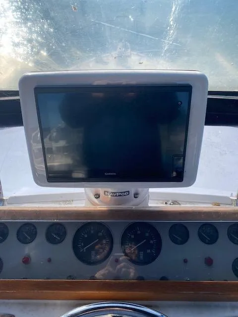 Slide: The Image of Dashboard of 1989 Ocean Alexander 42 yacht with navigation screen and gauges. - 48