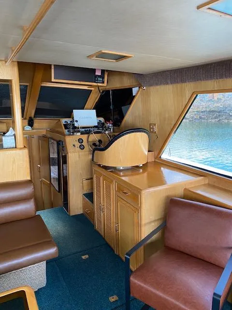 Slide: The Image of Interior of 1989 Ocean Alexander 42 yacht with wooden furnishings and helm station. - 7