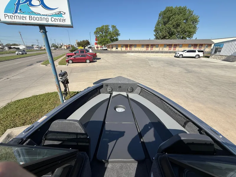 Slide: The Image of 2025 Lund 2075 IMPACT XS boat at Premier Boating Center parking lot. - 6