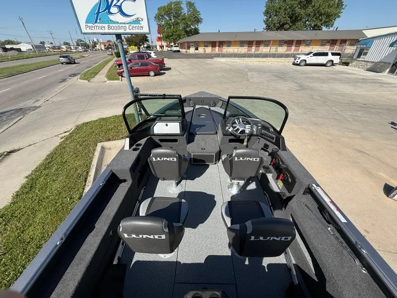 Slide: The Image of 2025 Lund 2075 IMPACT XS boat interior at Premier Boating Center parking lot. - 9