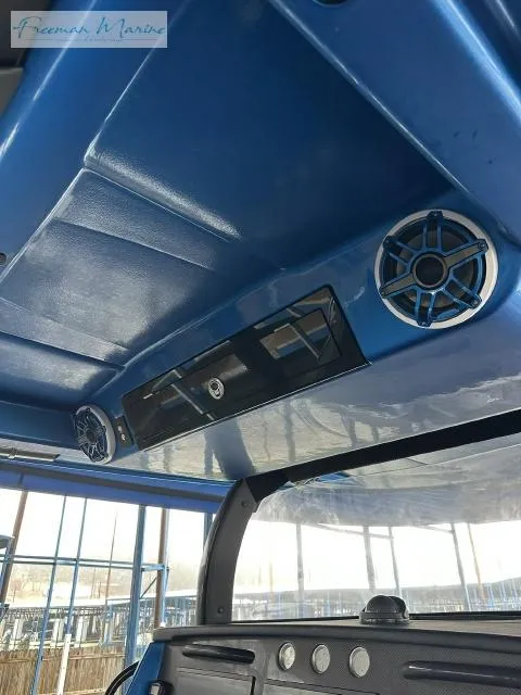 Slide: The Image of 2023 Fountain 43 NX boat interior with blue ceiling and speaker system. - 10