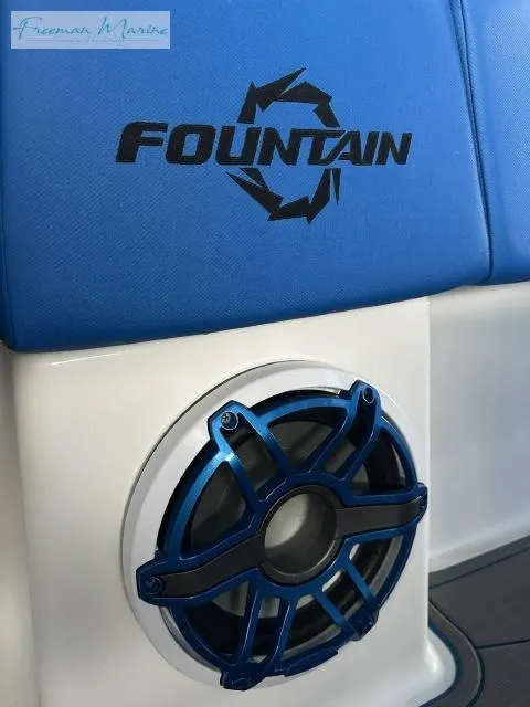 Slide: The Image of 2023 Fountain 43 NX boat interior with blue speaker and logo detail. - 12