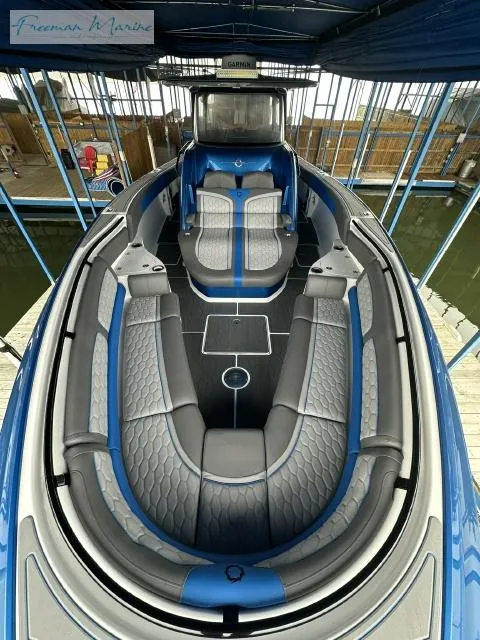 Slide: The Image of 2023 Fountain 43 NX boat with sleek blue and gray interior design. - 8