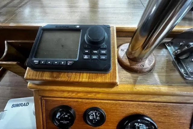 Slide: The Image of 1984 Grand Banks Trawler dashboard with navigation controls and gauges. - 21