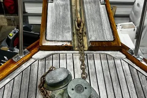 Slide: The Image of 1984 Grand Banks Trawler deck with anchor chain and winch. - 29