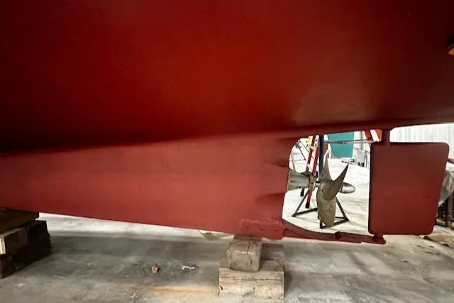 Slide: The Image of 1984 Grand Banks Trawler hull and propeller in dry dock. - 40