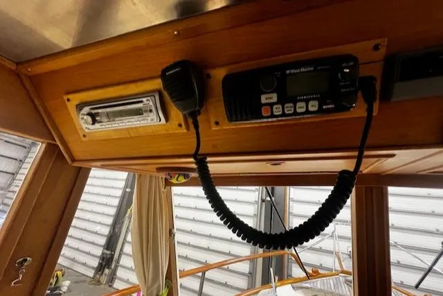 Slide: The Image of 1984 Grand Banks Trawler interior with radio and microphone setup. - 8