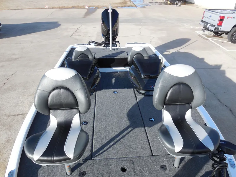 Slide: The Image of 2025 Vexus AVX1985S boat interior with dual seats and spacious deck. - 11