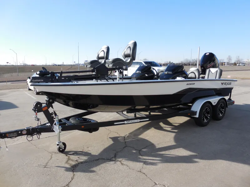 Slide: The Image of 2025 Vexus AVX1985S boat on trailer, parked outdoors. - 6
