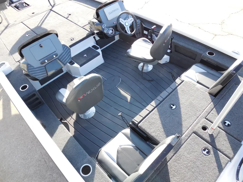Slide: The Image of 2025 Vexus AVX1985S boat interior with seating and steering console. - 7