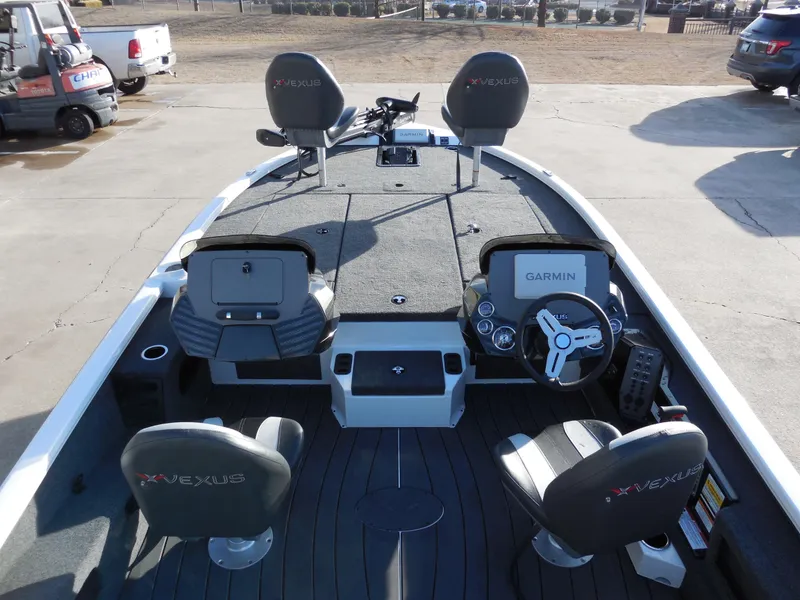 Slide: The Image of 2025 Vexus AVX1985S boat interior with Garmin electronics and seating. - 8