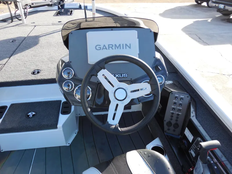 Slide: The Image of 2025 Vexus AVX1985S boat dashboard with Garmin navigation system and steering wheel. - 9