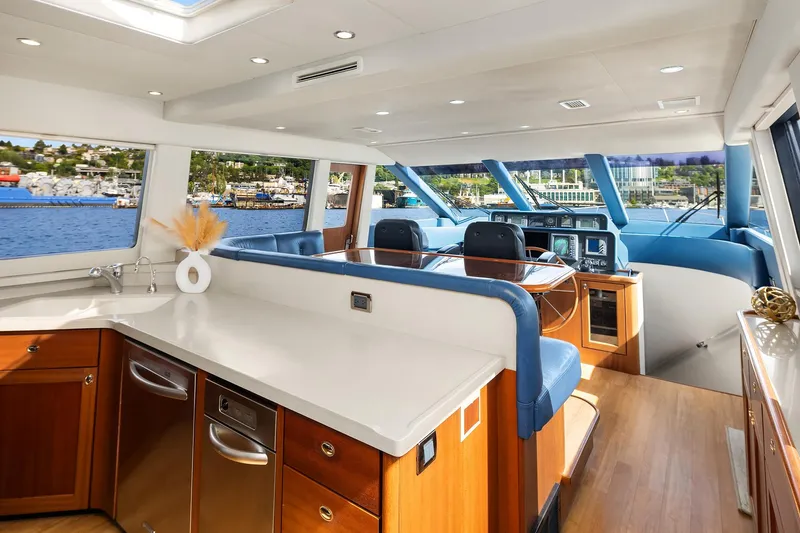 Slide: The Image of Luxurious 2003 Pacific Mariner Pilothouse interior with modern kitchen and scenic ocean views. - 14